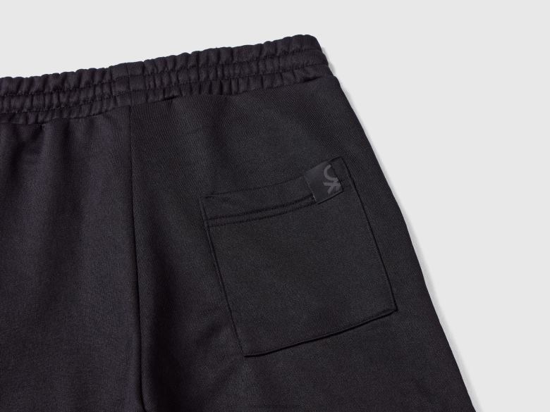 crianças joggers em tecido técnico Benetton R8L4P1909 preto